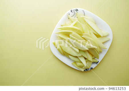 yellow ripe cut mango in a bowl top down yellow ripe cut mango in a bowl top down 94613253