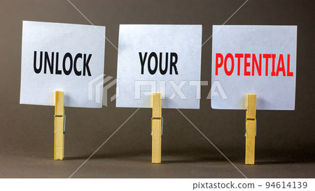 Unlock your potential symbol. Concept words Unlock your potential on white papers on wooden clothespins. Beautiful grey table grey background. Business unlock your potential concept. Copy space. Unlock your potential symbol. Concept words Unlock your potential on white papers on wooden clothespins. Beautiful grey table grey background. Business unlock your potential concept. Copy space. 94614139