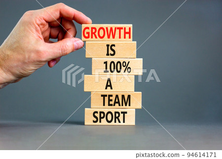 Growth symbol. Concept words Growth is 100 percent a team sport on wooden blocks on a beautiful grey table grey background. Businessman hand. Business motivational and growth is a team sport concept. Growth symbol. Concept words Growth is 100 percent a team sport on wooden blocks on a beautiful grey table grey background. Businessman hand. Business motivational and growth is a team sport concept. 94614171