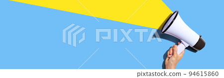 Attention and announcement concept with a megaphone 94615860