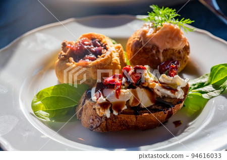 Italian tomato bruschetta with chopped vegetables, herbs and oil Italian tomato bruschetta with chopped vegetables, herbs and oil 94616033