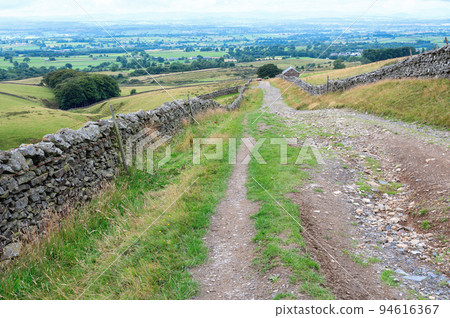 Walking Pennine way near Cumbria. The landscapes around Alston town, highest market settlement in England, selective focus 94616367