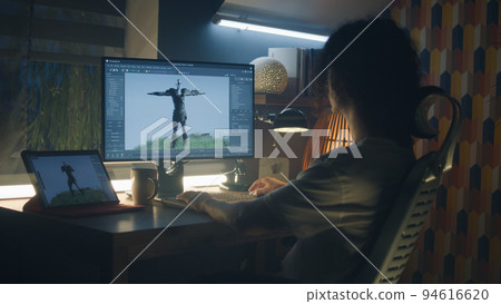Guy making 3D animation for video game Guy making 3D animation for video game 94616620