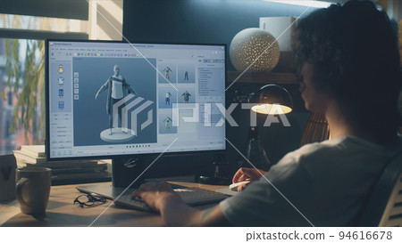 Man designing clothes in 3D modeling program Man designing clothes in 3D modeling program 94616678