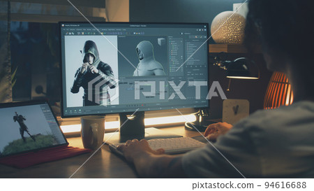 Guy making 3D animation for video game 94616688