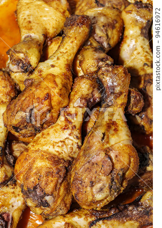 A close up of fried chicken legs, drumsticks, tasty and unhealthy food compilation 94616972