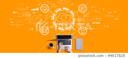 Backup concept with person working with laptop Backup concept with person working with laptop 94617828