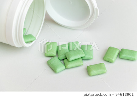 Green gum gum spilled from overturned container Green gum gum spilled from overturned container 94618901