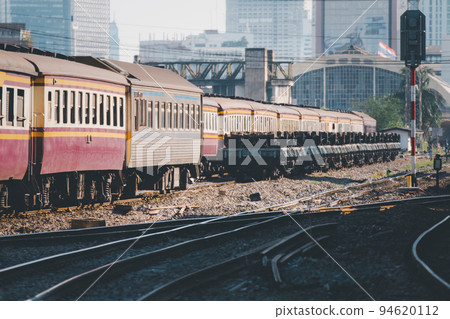 Thai railway train with locomotive runs in Bangkok Thai railway train with locomotive runs in Bangkok 94620112