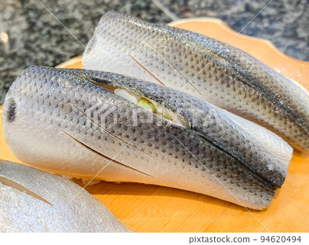 A handful of fresh kohada 94620494