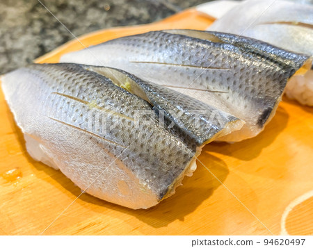 A handful of fresh kohada 94620497