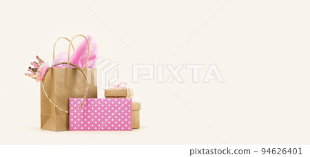 Gift or Sale concept. Shopping paper bag, Crown headband with pink tissue Gift or Sale concept. Shopping paper bag, Crown headband with pink tissue 94626401