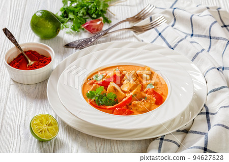 Fish Stew cooked with coconut milk and veggies 94627828