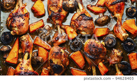 Grilled chicken legs with pumpkin Grilled chicken legs with pumpkin 94628403