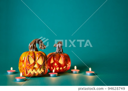 Halloween creative background with diy ceramic pumpkins jack lantern and candles 94628749