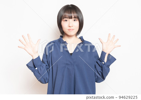 Woman showing the number 10 by hand Woman showing the number 10 by hand 94629225