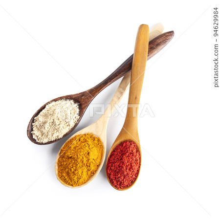 Mix of spice in wooden spoon on white backgrounds. Mix of spice in wooden spoon on white backgrounds. 94629984
