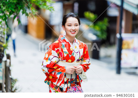 A woman in a kimono walking on the streets of Kyoto 94630101