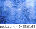 Abstract frosty pattern on glass, background texture on the window 94630163