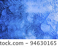 Abstract frosty pattern on glass, background texture on the window 94630165