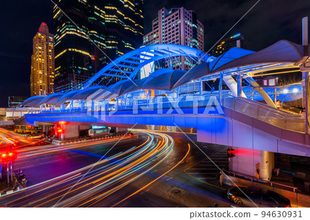 Long exposure of Traffic lighting on Sathorn road, Business center of Bangkok,Thailand. Long exposure of Traffic lighting on Sathorn road, Business center of Bangkok,Thailand. 94630931