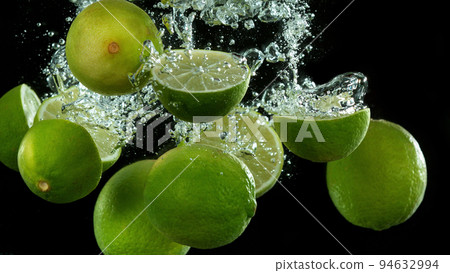 Lime fruit falling down and splashing underwater. Lime fruit falling down and splashing underwater. 94632994