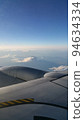 Mt. Fuji beyond the wings of an airplane 94634334
