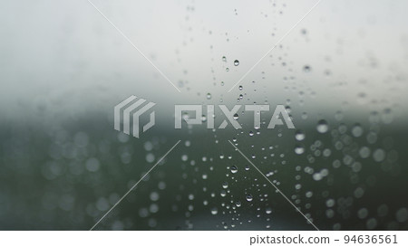Real background of rain hitting glass with protective coating Real background of rain hitting glass with protective coating 94636561