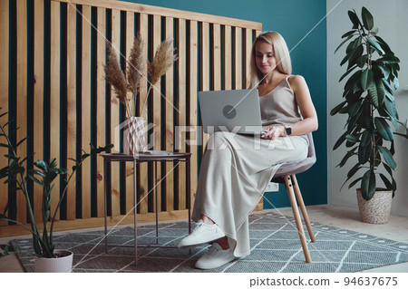 Young woman using laptop and holding online conference, remote work at home Young woman using laptop and holding online conference, remote work at home 94637675