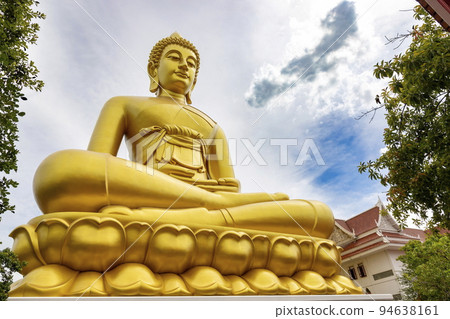 "Phra Buddha Dhammakaya Thep Mongkol" is a Big golden buddha statue made of copper, as tall as a 20-storey building (69 meters), located at Wat Paknam Bhasicharoen. Bangkok, Thailand on a sunny day "Phra Buddha Dhammakaya Thep Mongkol" is a Big golden buddha statue made of copper, as tall as a 20-storey building (69 meters), located at Wat Paknam Bhasicharoen. Bangkok, Thailand on a sunny day 94638161