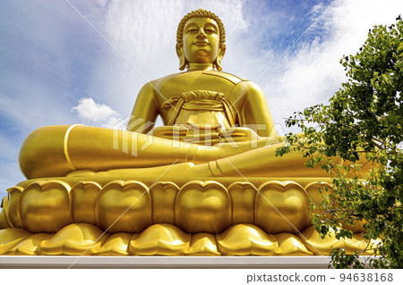 "Phra Buddha Dhammakaya Thep Mongkol" is a Big golden buddha statue made of copper, as tall as a 20-storey building (69 meters), located at Wat Paknam Bhasicharoen. Bangkok, Thailand on a sunny day "Phra Buddha Dhammakaya Thep Mongkol" is a Big golden buddha statue made of copper, as tall as a 20-storey building (69 meters), located at Wat Paknam Bhasicharoen. Bangkok, Thailand on a sunny day 94638168