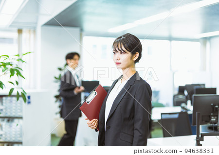 A business person wearing a suit working at work 94638331