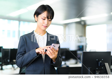 A business person wearing a suit working at work 94638358