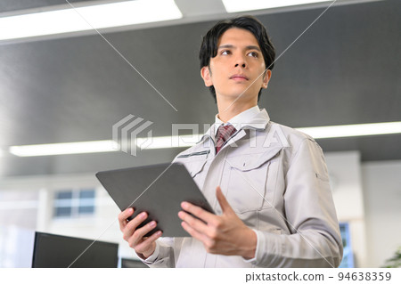 Young engineer working with a tablet 94638359