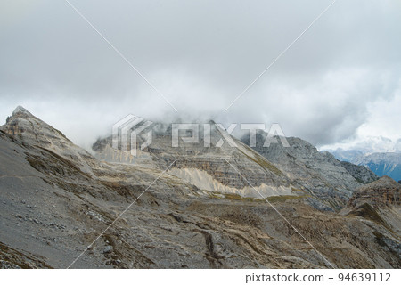 Dolomite rock wall at mountain range. Dolomites UNESCO Italian Alps landscape 94639112