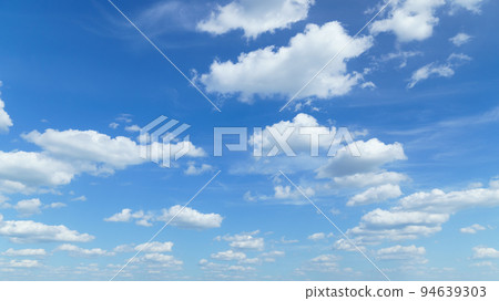 beautiful blue sky with clouds on bright sunny day for abstract background 94639303