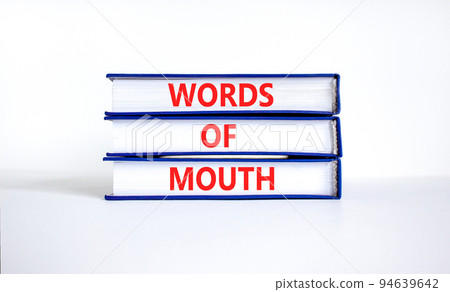 Words of mouth symbol. Concept words Words of mouth on books on a beautiful white table white background. Business, finacial and words of mouth concept. Copy space. 94639642