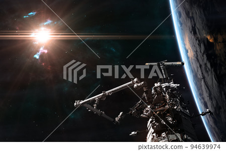 ISS orbiting Earth in light of bright sun ISS orbiting Earth in light of bright sun 94639974