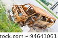Damaged and destroyed civilian car with shrapnel holes from Russian missile in a war zone in Kharkiv, Ukraine 94641061