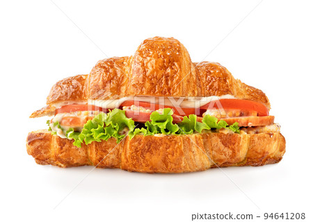 Croissant sandwich with ham, lettuce, tomatoes isolated on white background. Healthy and fast food. Croissant sandwich with ham, lettuce, tomatoes isolated on white background. Healthy and fast food. 94641208