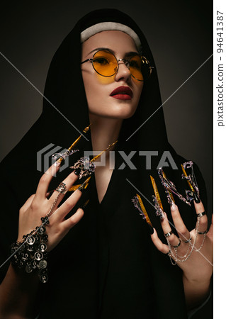 Beautiful woman with art makeup, creative long nails. Design manicure. Beauty face. Beautiful woman with art makeup, creative long nails. Design manicure. Beauty face. 94641387