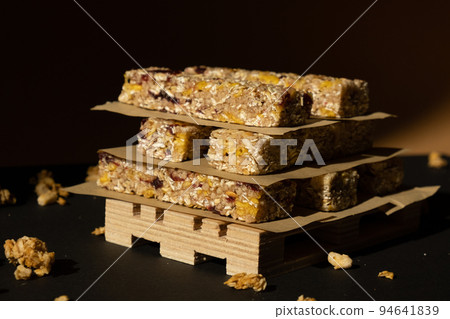 Homemade Granola energy bar. Variety of homemade protein granola breakfast bars with nuts, raisins dried cherries and chocolate. Healthy nutrition eating Gluten free cereal dieting snack super food 94641839