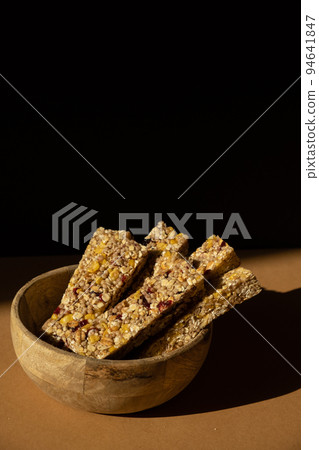 Homemade Granola energy bar. Variety of homemade protein granola breakfast bars with nuts, raisins dried cherries and chocolate. Healthy nutrition eating Gluten free cereal dieting snack super food Homemade Granola energy bar. Variety of homemade protein granola breakfast bars with nuts, raisins dried cherries and chocolate. Healthy nutrition eating Gluten free cereal dieting snack super food 94641847