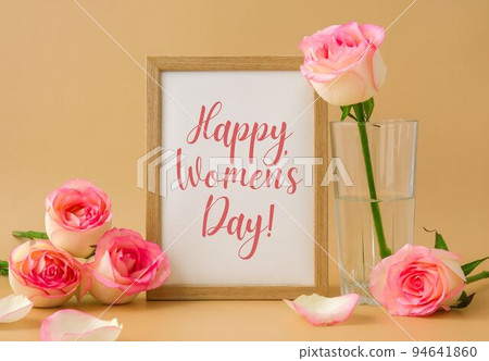 Mockup Wooden frame with text HAPPY WOMENS DAY on delicate pink roses on beige background. Minimal trendy composition. Romantic pastel pink rose flowers. Neutral earth tones Mockup Wooden frame with text HAPPY WOMENS DAY on delicate pink roses on beige background. Minimal trendy composition. Romantic pastel pink rose flowers. Neutral earth tones 94641860