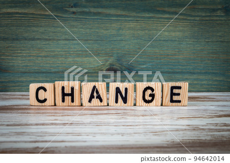 CHANGE. Wooden alphabet letters on a green and white background 94642014