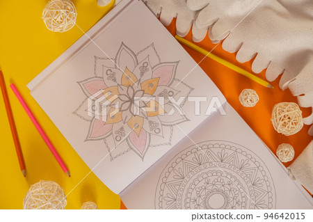 Mandalas antistress page to combat stress. Relaxing hobby mental wellbeing and art therapy. Meditative process of coloring pages. Self expression by art  94642015