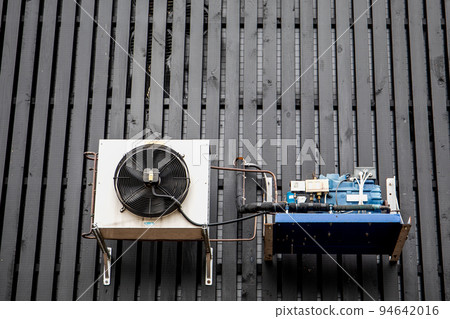 Air conditioning, ventilation and heating equipment. Black board building facade 94642016