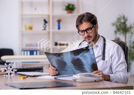Young male doctor radiologist working in the clinic Young male doctor radiologist working in the clinic 94642101
