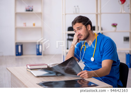 Young male doctor radiologist working in the clinic 94642163