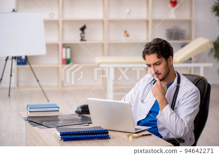 Young male doctor in telemedicine concept 94642271